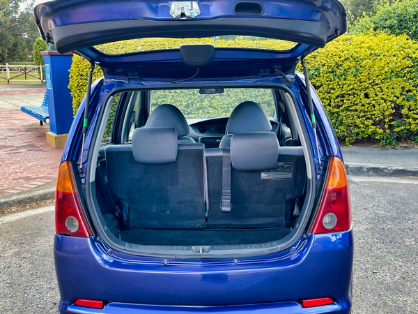 Rear tailgate open showing how much space inside a Diahatsu YRV