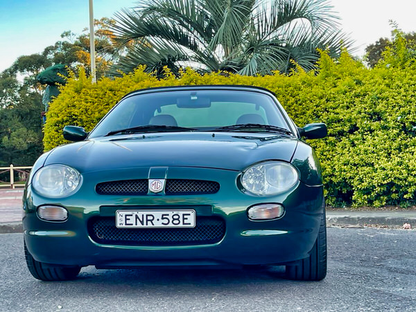 Used MG convertible for sale in Sydney - photo showing the front grille, headlights in British Racing Green colour