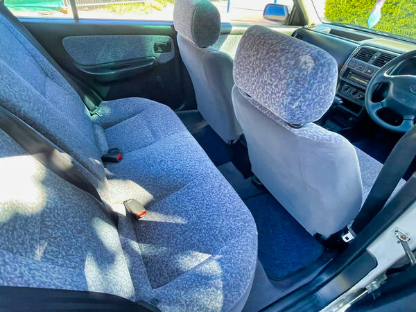 Used Nissan Pulsar for sale - automatic model with body styling - photo showing the rear seats clean and in good condition
