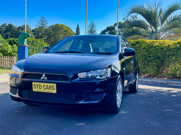 Used Lancer for sale in Sydney - photo showing a black lancer from the front passenger side angle view