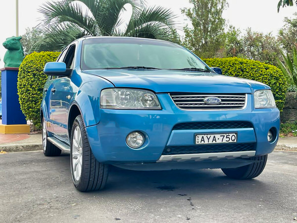 Used Ford Territory for sale in Sydney - 2006 Automatic Ghia full leather model - photo showing the low front side angle view of the vehicle