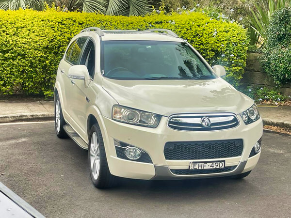 Used Holden Captiva for sale in Sidney - automatic 7 seater model - photo showing the front drivers side angle view with colour coded bumpers and grille