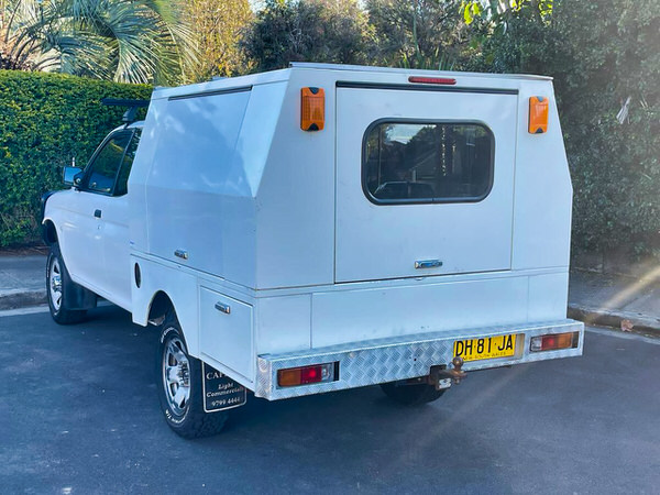 Tradie 4x4 for sale - Mitsubishi Triton with 3 way storage unit at the back - photo showing the rear canopy storage unit with steel doors and towbar 