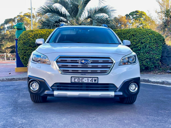 Used Subaru for sale - Fantastic Online Customer Reviews - Model shown is the 2016 white Turbo Diesel Subaru Outback - Photo showing the straight on front view with colour matching bumper and impressive front grille