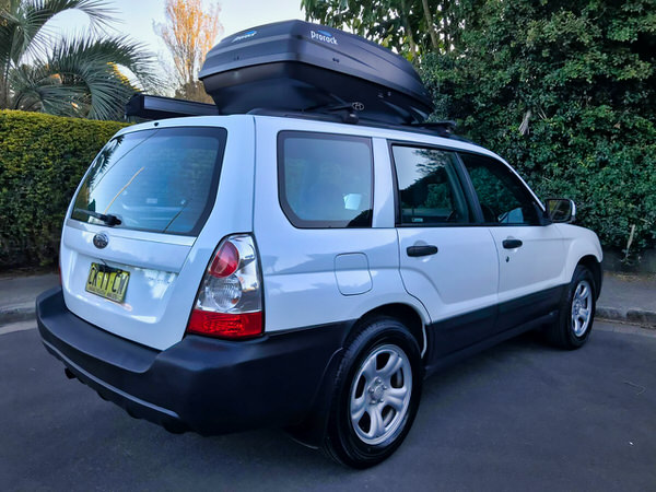 4x4 camper for sale - Photo showing a Subaru Forester 2 person campervan from the front passenger side angle view with roof box included