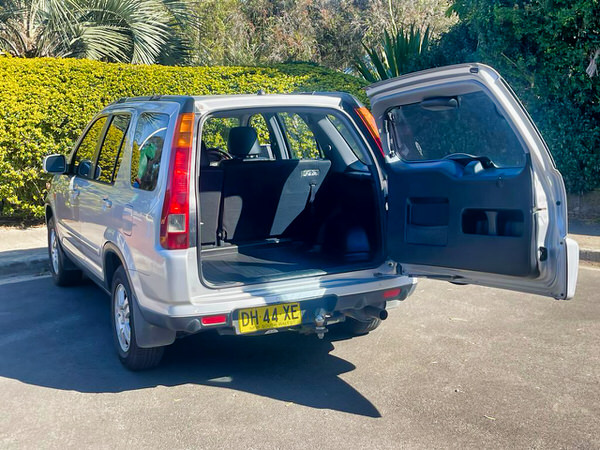  Used Honda 4x4 for sale in Sydney - Automatic 2003 Silver coloured Model - photo showing the back of the CRV with the wide opening read door open