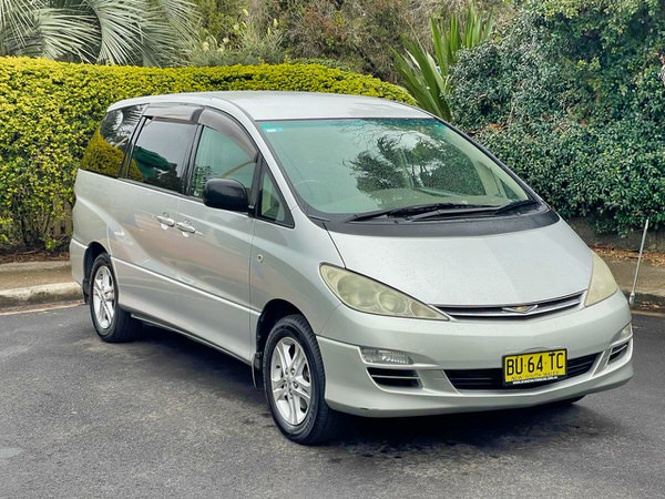 Used Toyota Tarago for sale - Automatic 8 seater family model - Photo showing the front low angle drive side view