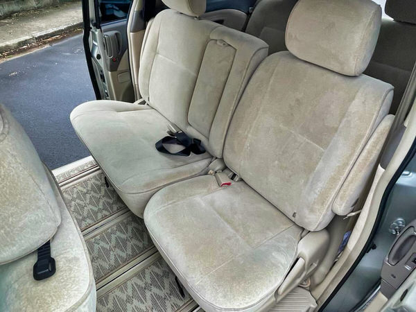 Used Toyota Tarago for sale - Automatic 8 seater family model - Photo showing the middle row of seats with split fold design with child safety anchor points to fix two child seats