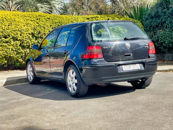 Used Golf for sale in Sydney - Modern day classic 2003 MK4 Automatic black Golf - photo showing the view from the rear passenger side angle view