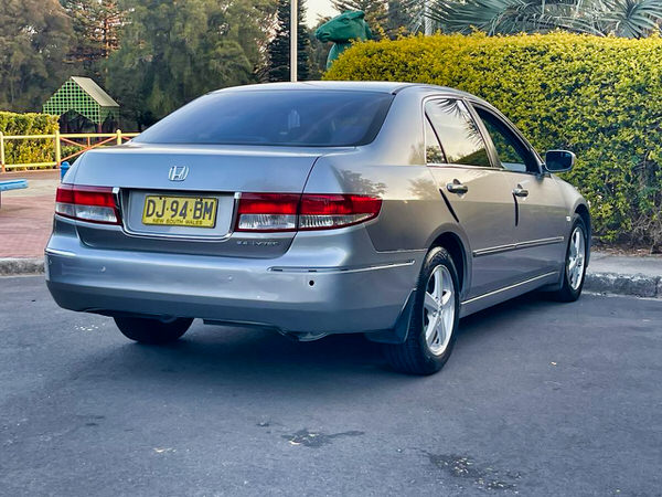 Used Honda Accord for sale in Sydney - Automatic Model. Photo showing the rear drivers side angle view
