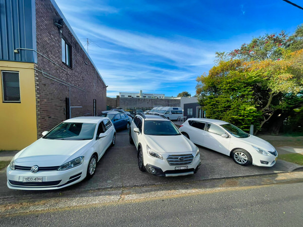 Sydneycars Yard photo 4 - showing three white automatic cars for sale under $10000 in Sydney