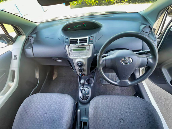 Toyota Yaris for sale - 2009 Automatic white model - photo showing the view sitting in the driver seat looking forward