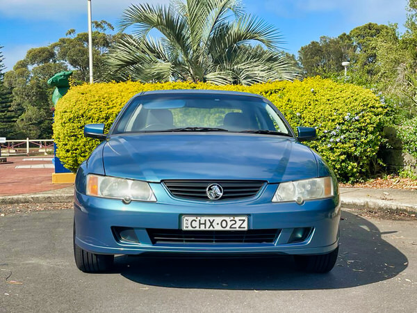 Used Holden Commodore for Sale - photo showing an automatic Holden Commodore 25th Anniversary Series II 2003 model from the front straight on view with colour matching bumper and front grille