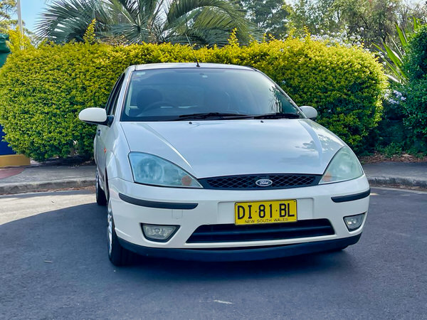Ford Focus for sale in Sydney - Automatic 2003 model in white - photo showing the front straight on view with colour matching front bumper and grille