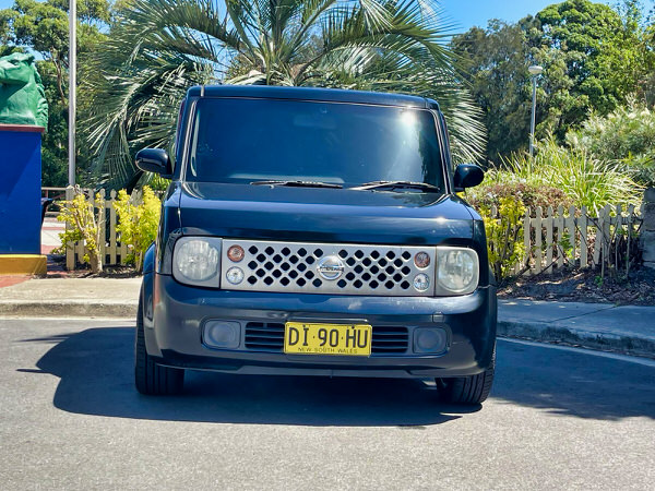 Used Nissan for sale - Nissan Cube 2002 automatic model import to Australia and COMPLIED IN 2012. Photo of the straight front on view of the Cube with matching colour coded front bumper and silver grille