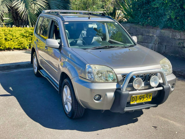 Small SUV for sale - Nissan X-Trail 2004 Model with twin headlamps - Photo showing the front drivers side angle view
