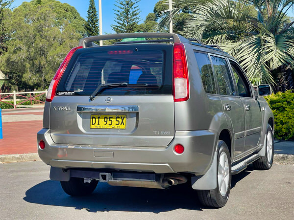 Small SUV for sale - Nissan X-Trail 2004 Model with twin headlamps - Photo showing the rear drivers side angle view
