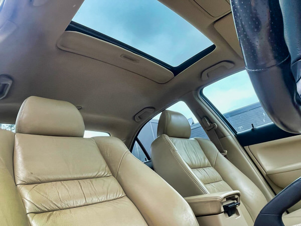 Used Honda Accord for sale in Sydney - Automatic white 2003 Model. Photo showing the view sitting in the driver seat looking up out of the sunroof