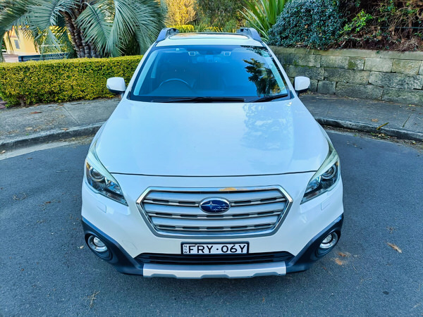 Used Subaru for sale - Fantastic Online Customer Reviews - Model shown is the 2016 white 2.0L Turbo Diesel Subaru Outback - Photo of the front straight on view showing the colour matching front bumper and grille