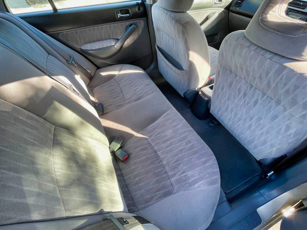 Used Honda Civic for sale in Sydney. Automatic model with low KMS + Full Service History in immaculate condition. Photo showing the view sitting in rear seats and they look brand news and never been used much by previous owner