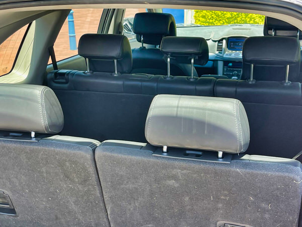 Used 7 seater SUV Holden Captiva for sale - Automatic 2015 model in Charcoal - photo showing the view from the back of the vehicle with three rows of seats able to hold seven passengers comfortably.