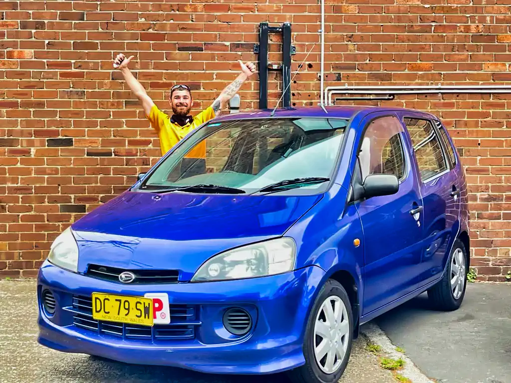 Happy customer with their new manual car Sydney